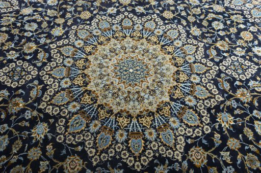 Central medallion detail of 2000s Kashan rug from Iran / Persia