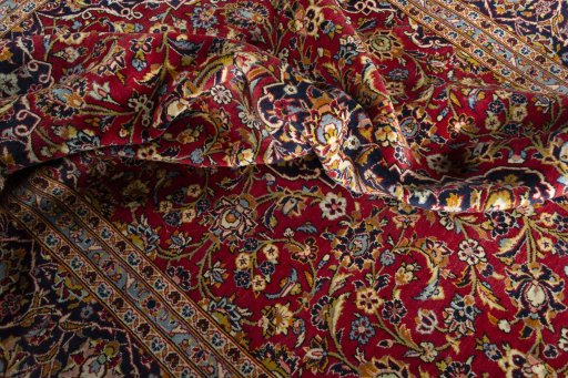 Surface texture of 2000s Kashan rug with natural Wool and intricate pattern