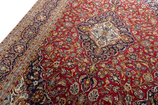 Backside of handmade 2000s Kashan rug showing knot structure and weave density