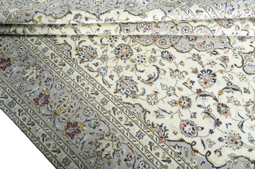 Close-up detail of 2000s Kashan rug from Iran / Persia showing Wool weave