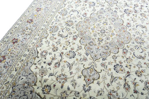 Backside of handmade 2000s Kashan rug showing knot structure and weave density