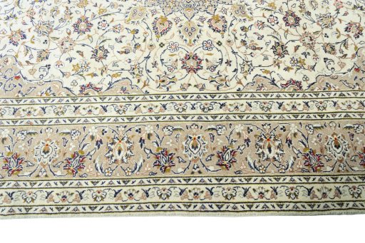 Corner detail of 2000s Kashan rug showing border pattern and Wool pile