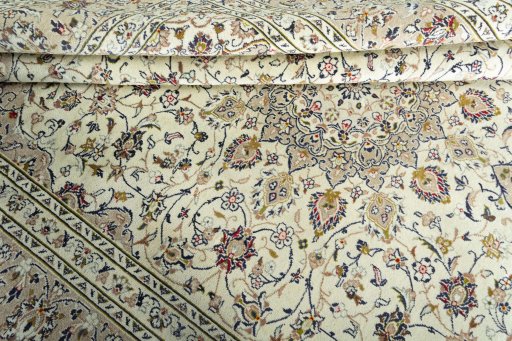 Close-up detail of 2000s Kashan rug from Iran / Persia showing Wool weave