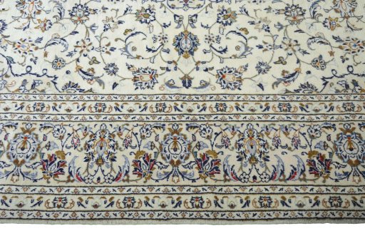 Corner detail of New Kashan rug showing border pattern and Wool pile