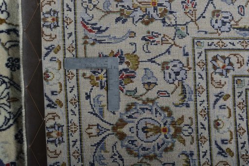 Backside of handmade New Kashan rug showing knot structure and weave density
