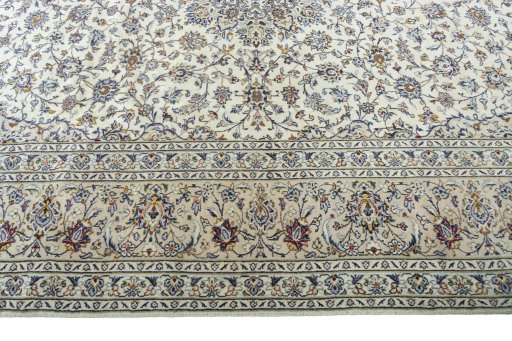 Corner detail of 2000s Kashan rug showing border pattern and Wool pile