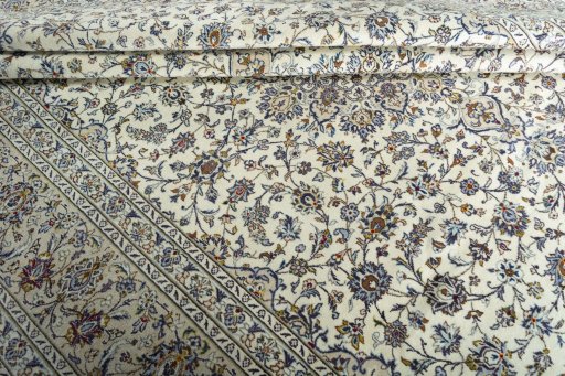 Close-up detail of 2000s Kashan rug from Iran / Persia showing Wool weave