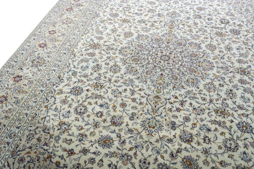 Backside of handmade 2000s Kashan rug showing knot structure and weave density