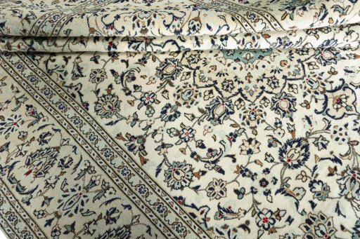 Close-up detail of 2000s Kashan rug from Iran / Persia showing Wool weave