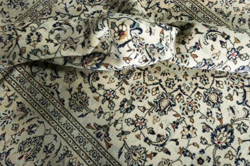 Surface texture of 2000s Kashan rug with natural Wool and intricate pattern