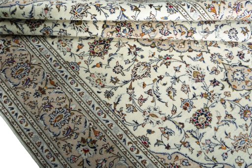 Close-up detail of 2000s Kashan rug from Iran / Persia showing Wool weave