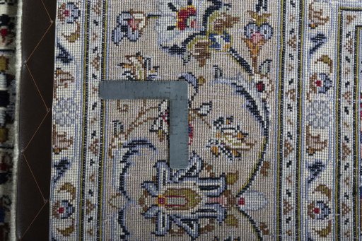 Backside of handmade 2000s Kashan rug showing knot structure and weave density