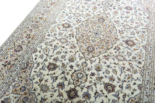 Backside of handmade 2000s Kashan rug showing knot structure and weave density