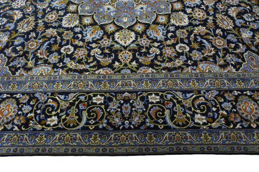 Corner detail of New Kashan rug showing border pattern and Wool pile