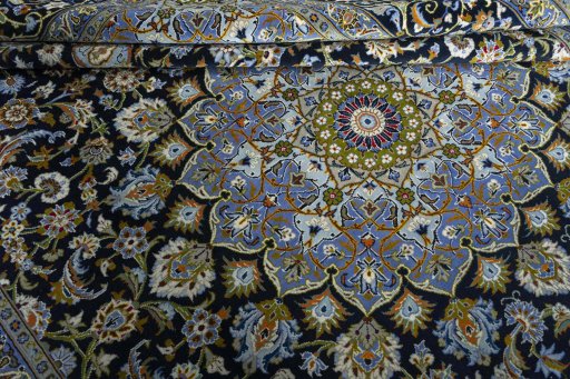 Close-up detail of New Kashan rug from Iran / Persia showing Wool weave