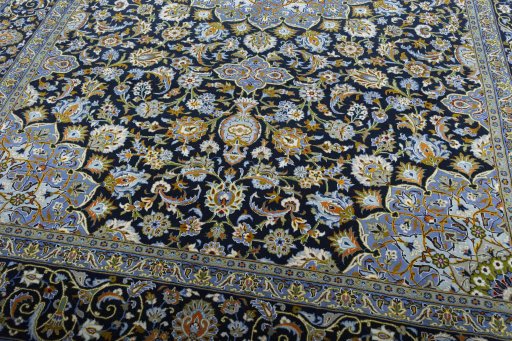 Close-up detail of New Kashan rug from Iran / Persia showing Wool weave