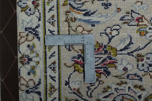 Backside of handmade 2000s Kashan rug showing knot structure and weave density