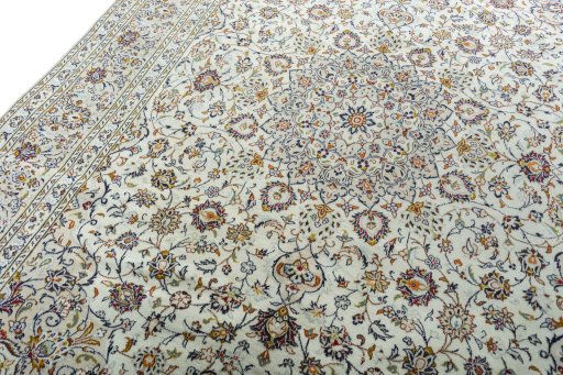 Backside of handmade 2000s Kashan rug showing knot structure and weave density