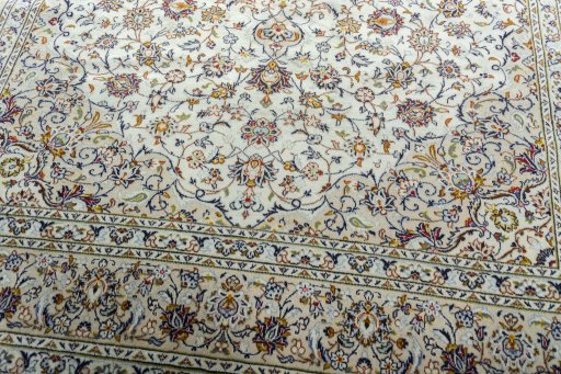 Close-up detail of 2000s Kashan rug from Iran / Persia showing Wool weave