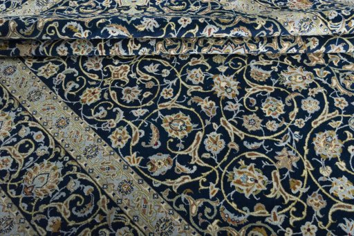 Close-up detail of 2000s Kashan rug from Iran / Persia showing Wool weave