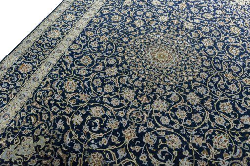 Backside of handmade 2000s Kashan rug showing knot structure and weave density