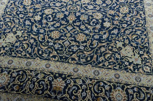 Close-up detail of 2000s Kashan rug from Iran / Persia showing Wool weave