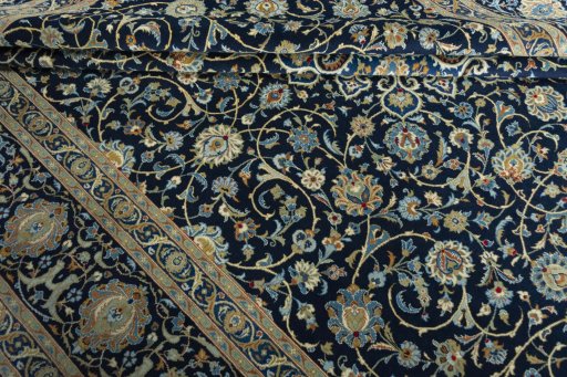 Close-up detail of 2000s Kashan rug from Iran / Persia showing Wool weave