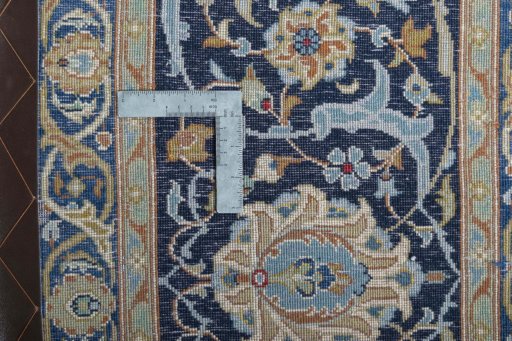 Backside of handmade 2000s Kashan rug showing knot structure and weave density