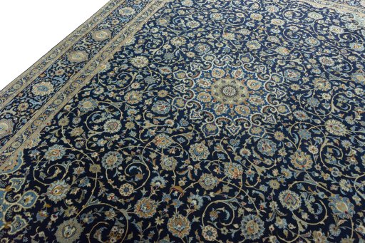 Backside of handmade 2000s Kashan rug showing knot structure and weave density