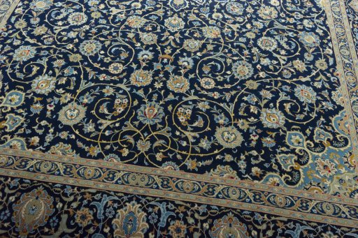 Close-up detail of 2000s Kashan rug from Iran / Persia showing Wool weave