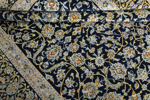 Close-up detail of 2000s Kashan rug from Iran / Persia showing Wool weave