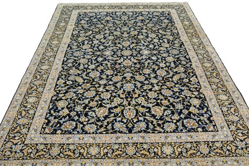 Surface texture of 2000s Kashan rug with natural Wool and intricate pattern