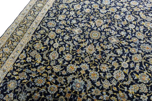Backside of handmade 2000s Kashan rug showing knot structure and weave density