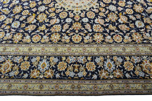 Corner detail of 2000s Kashan rug showing border pattern and Wool pile