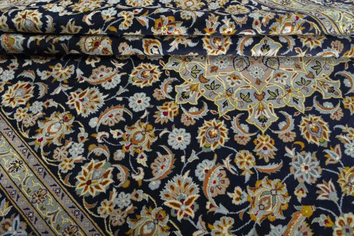 Close-up detail of 2000s Kashan rug from Iran / Persia showing Wool weave