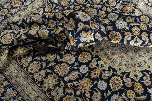 Surface texture of 2000s Kashan rug with natural Wool and intricate pattern