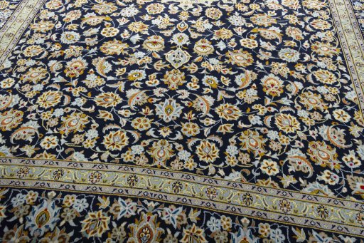 Close-up detail of 2000s Kashan rug from Iran / Persia showing Wool weave