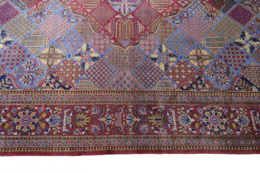Corner detail of 1930s Kashan rug showing border pattern and Silk pile