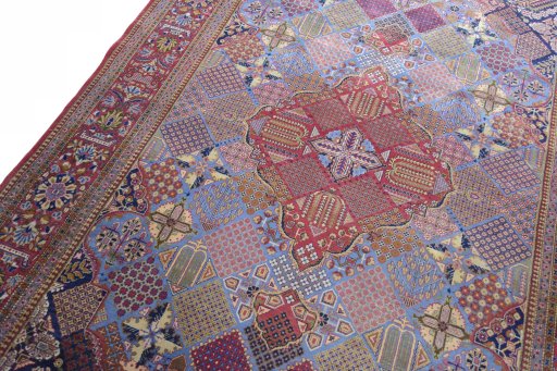 Backside of handmade 1930s Kashan rug showing knot structure and weave density