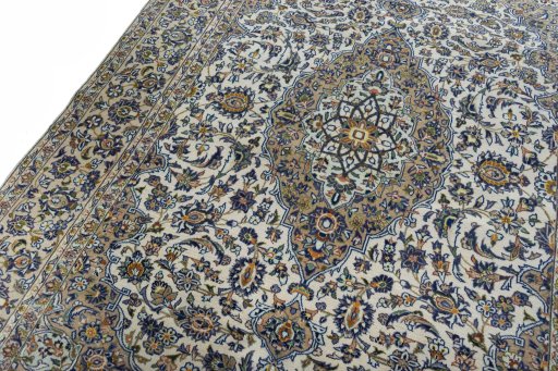 Backside of handmade 2000s Kashan rug showing knot structure and weave density