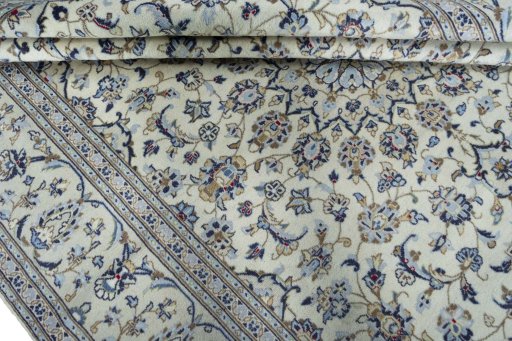 Backside of handmade 2000s Kashan rug showing knot structure and weave density