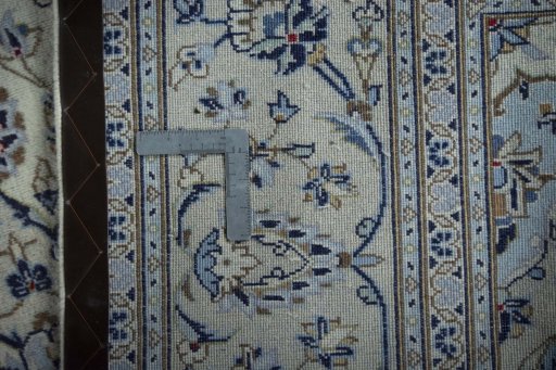 Close-up detail of 2000s Kashan rug from Iran / Persia showing Wool weave