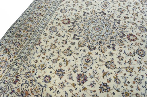 Backside of handmade 2000s Kashan rug showing knot structure and weave density