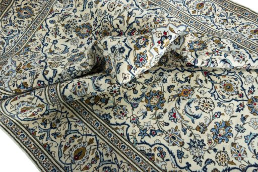 Surface texture of 2000s Kashan rug with natural Wool and intricate pattern
