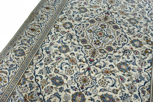 Backside of handmade 2000s Kashan rug showing knot structure and weave density