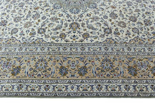 Corner detail of 2000s Kashan rug showing border pattern and Wool pile