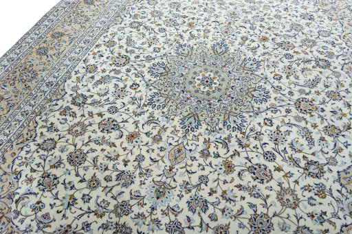 Backside of handmade 2000s Kashan rug showing knot structure and weave density