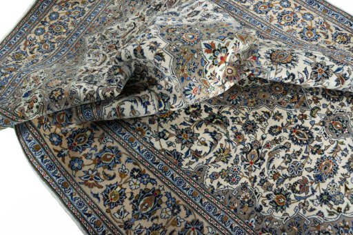 Surface texture of 2000s Kashan rug with natural Wool and intricate pattern