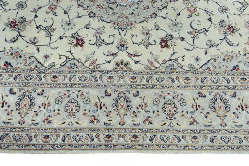 Corner detail of New Kashan rug showing border pattern and Wool pile