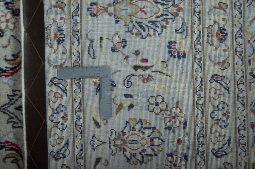 Backside of handmade New Kashan rug showing knot structure and weave density